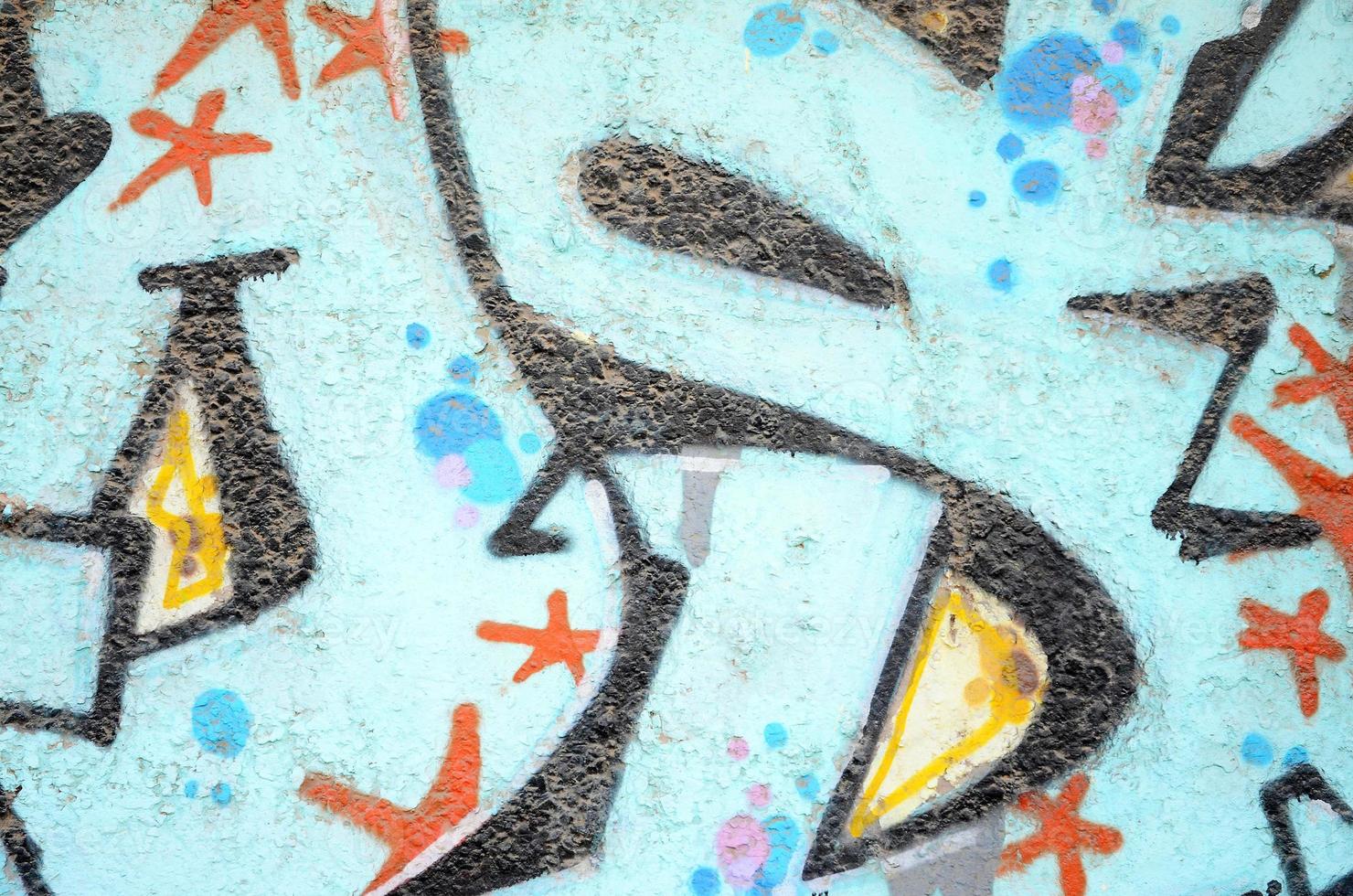 Texture of a fragment of the wall with graffiti painting, which is depicted on it. An image of a piece of graffiti drawing as a photo on street art and graffiti culture topics