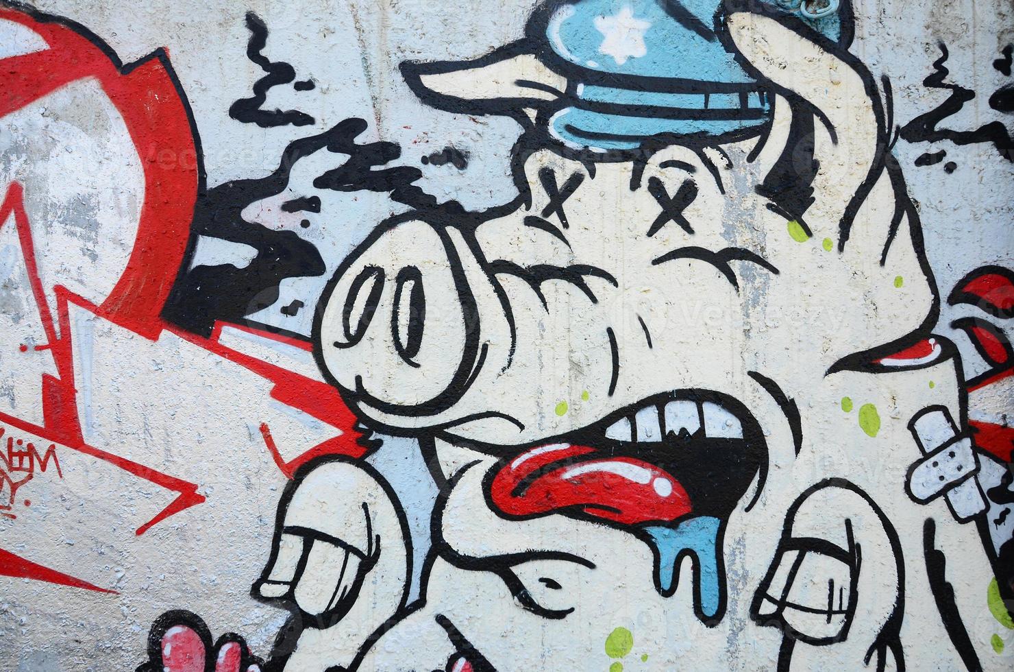 Texture of a fragment of the wall with graffiti painting, which is depicted on it. An image of a piece of graffiti drawing as a photo on street art and graffiti culture topics