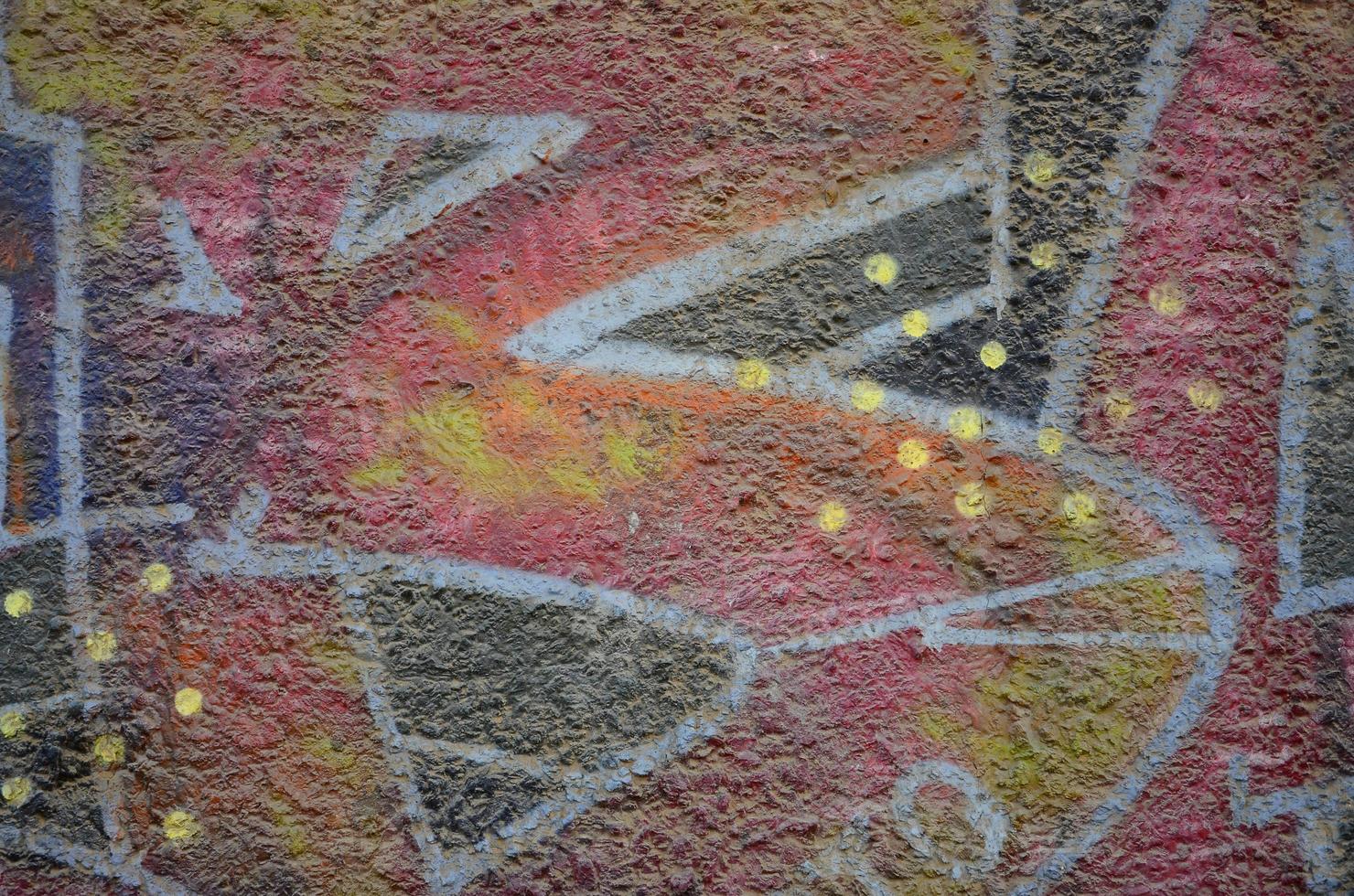 Texture of a fragment of the wall with graffiti painting, which is depicted on it. An image of a piece of graffiti drawing as a photo on street art and graffiti culture topics