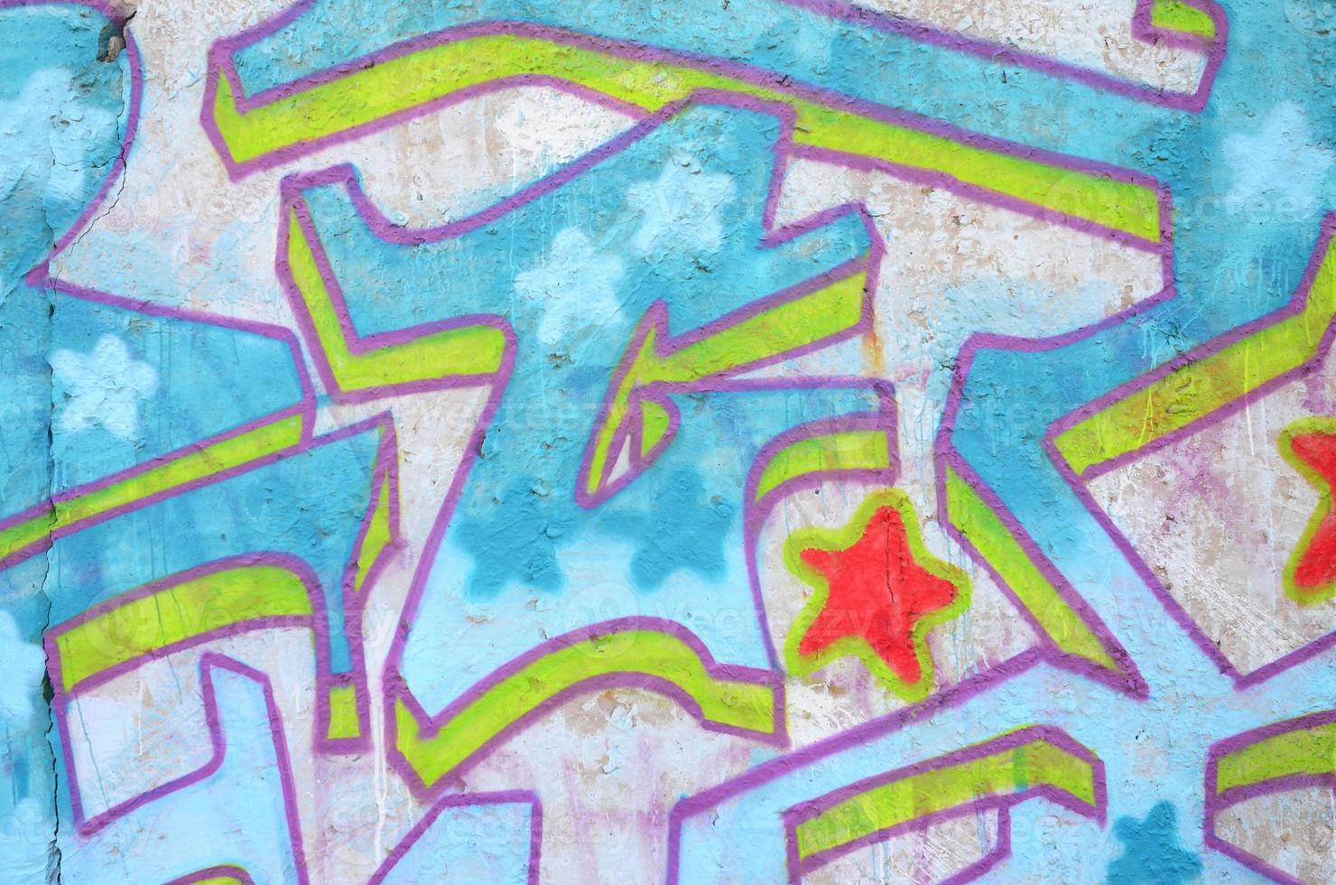 Texture of a fragment of the wall with graffiti painting, which is depicted on it. An image of a piece of graffiti drawing as a photo on street art and graffiti culture topics