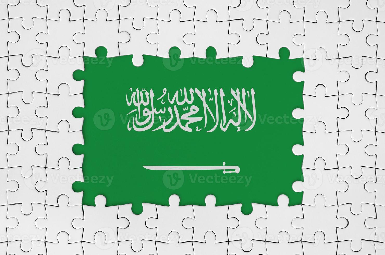 Saudi Arabia flag in frame of white puzzle pieces with missing central part photo