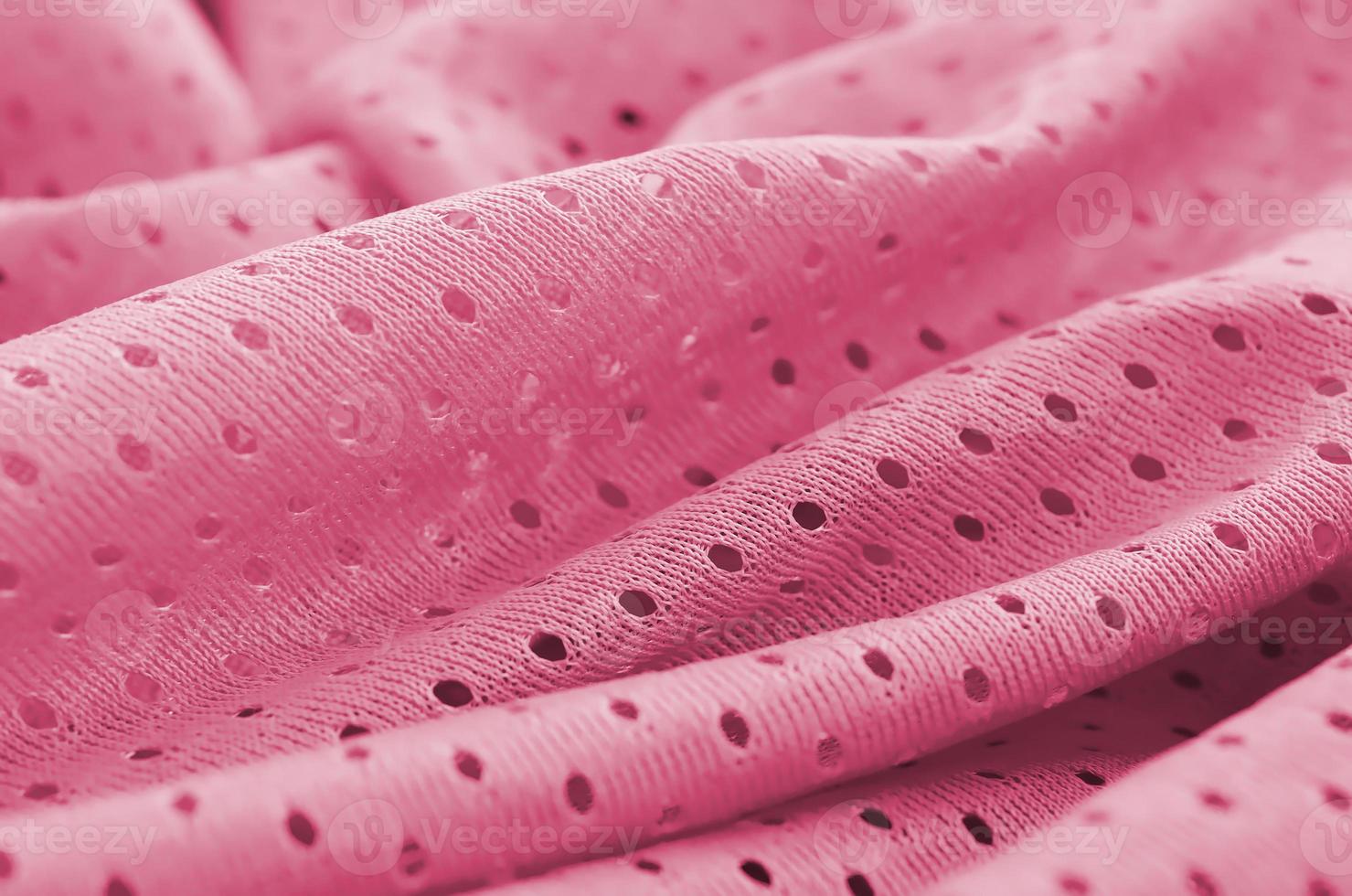 Mesh sport wear fabric textile background pattern Image toned in Viva Magenta, color of the 2023 year photo
