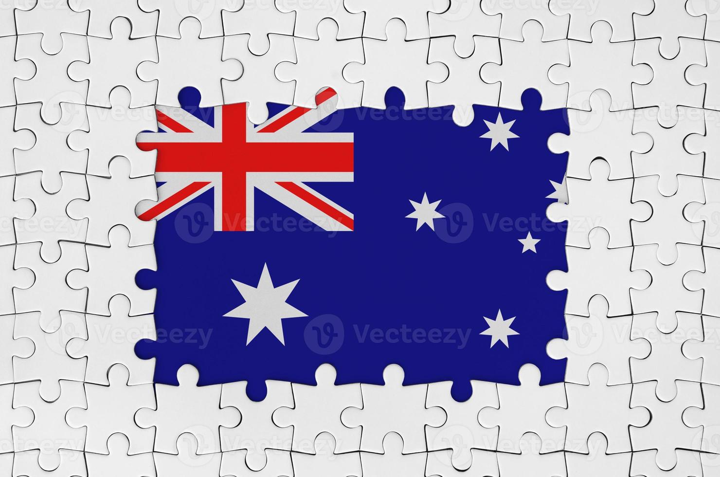 Australia flag in frame of white puzzle pieces with missing central part photo