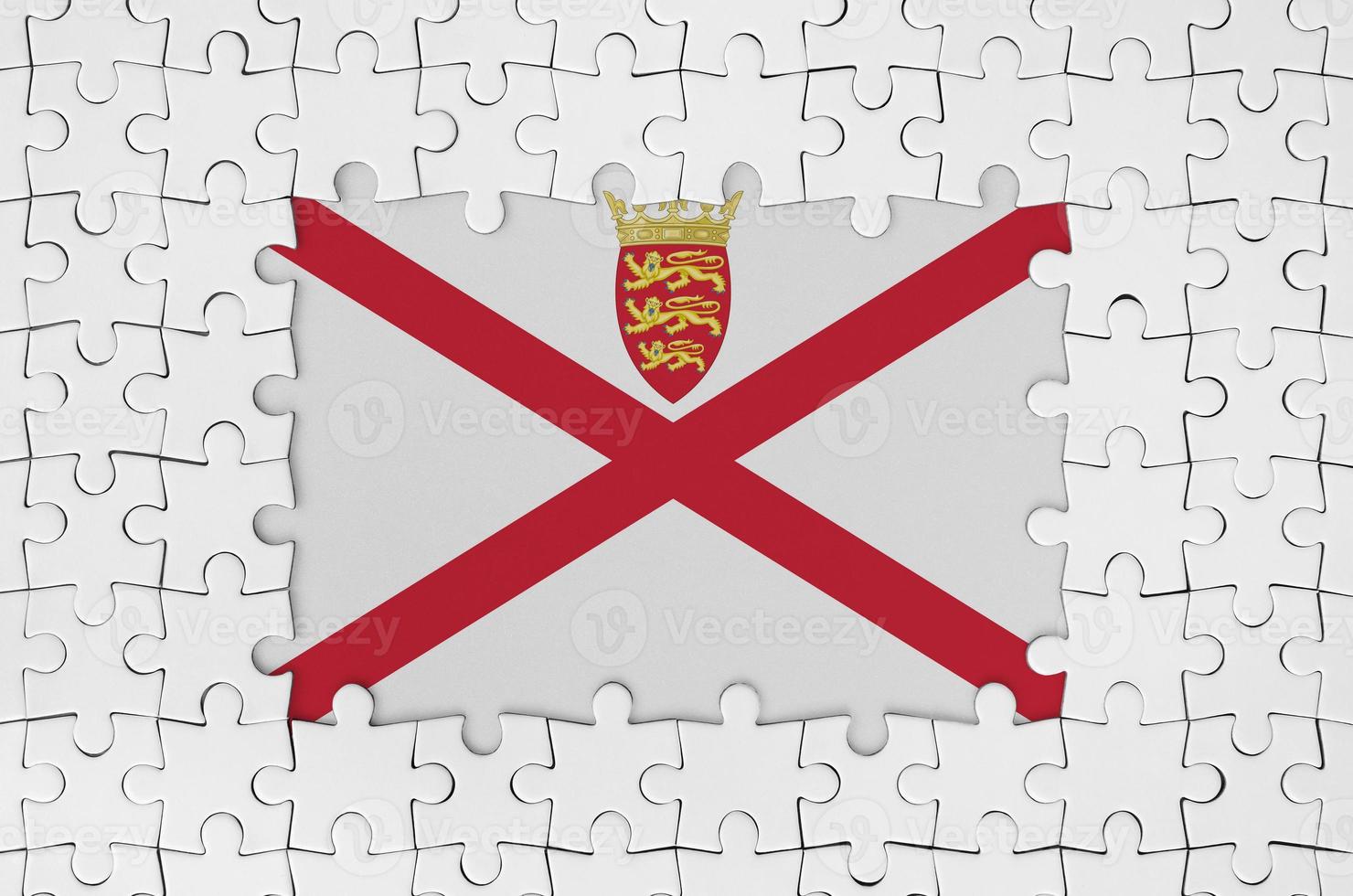 Jersey flag in frame of white puzzle pieces with missing central part photo