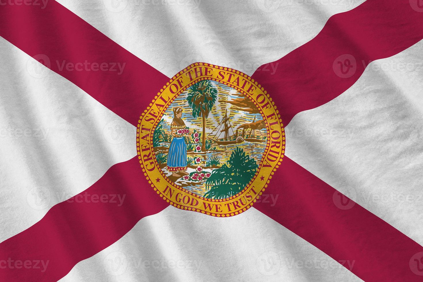 Florida US state flag with big folds waving close up under the studio light indoors. The official symbols and colors in banner photo