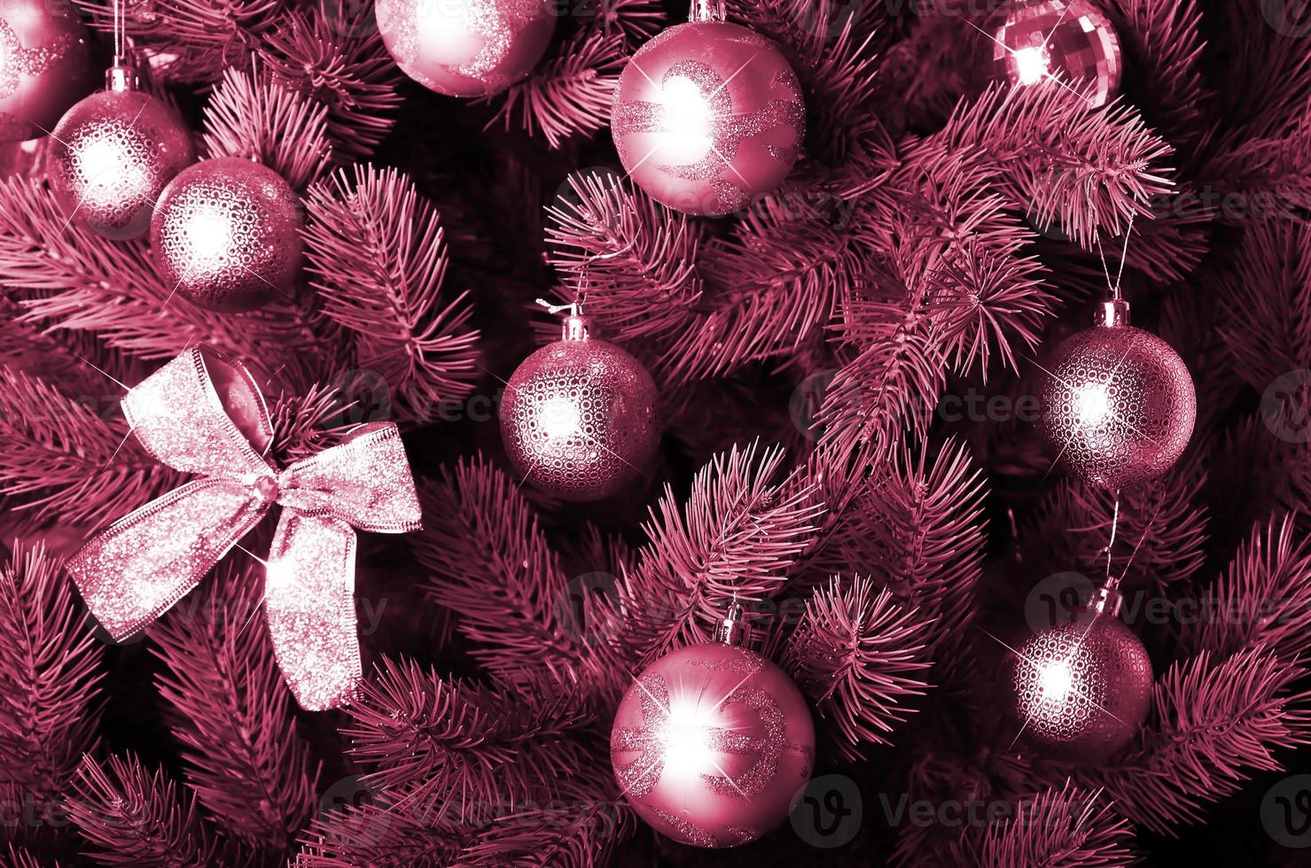 Detailed photo of the Christmas tree Image toned in Viva Magenta, color of the 2023 year