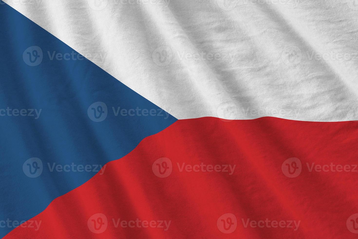 Czech flag with big folds waving close up under the studio light indoors. The official symbols and colors in banner photo