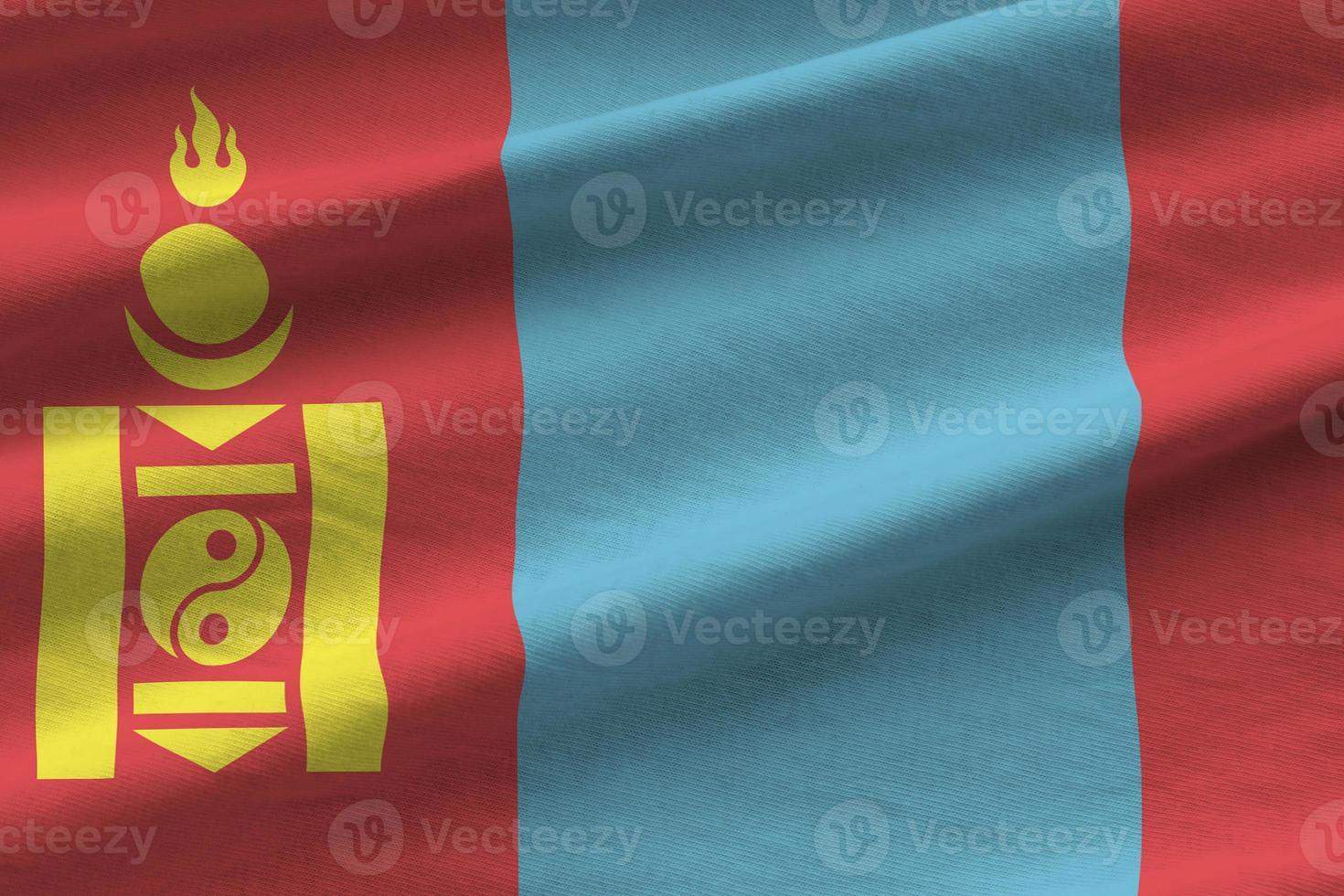Mongolia flag with big folds waving close up under the studio light indoors. The official symbols and colors in banner photo