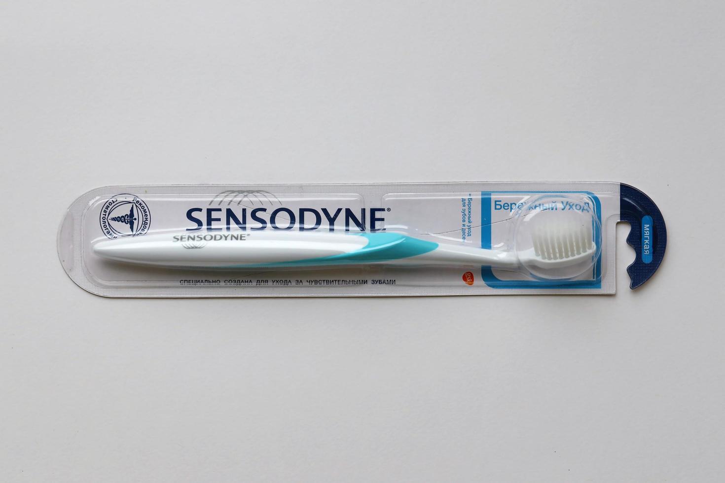 KYIV, UKRAINE - MAY 4, 2022 Sensodyne new brand toothbrush for sensitive tooths photo