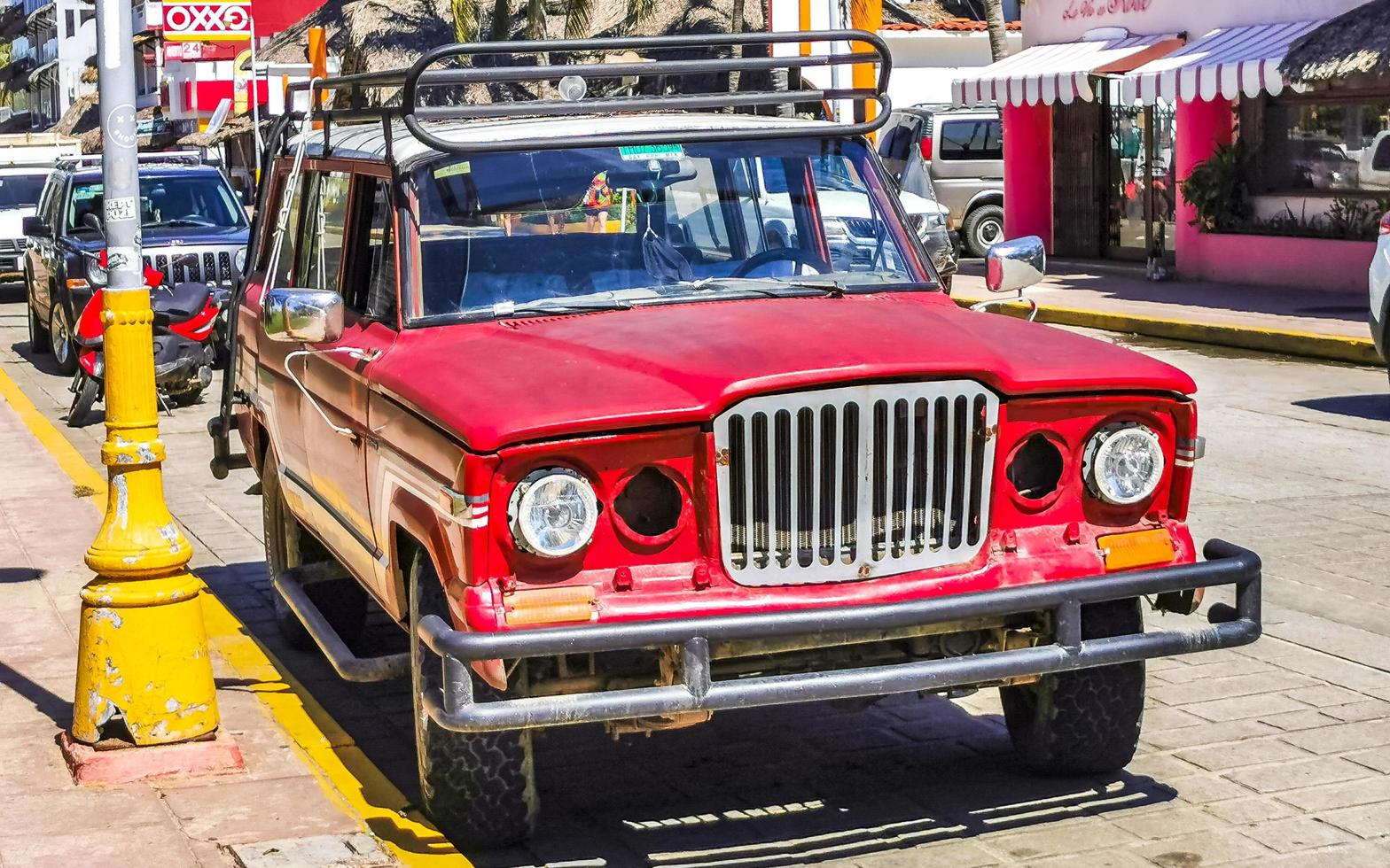 Puerto Escondido Oaxaca Mexico 2022 Various colorful tuned cars and classic vintage cars  Mexico. photo