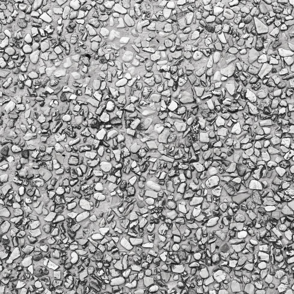 The pattern small black and grey pebbles stone as background. pebbles texture wall and floor. photo