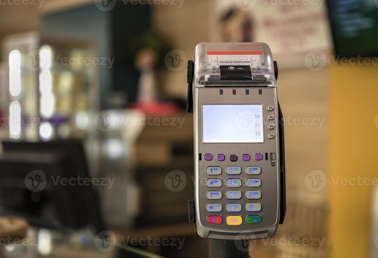card payment terminal POS terminal at a shop, close up. Blurred background photo