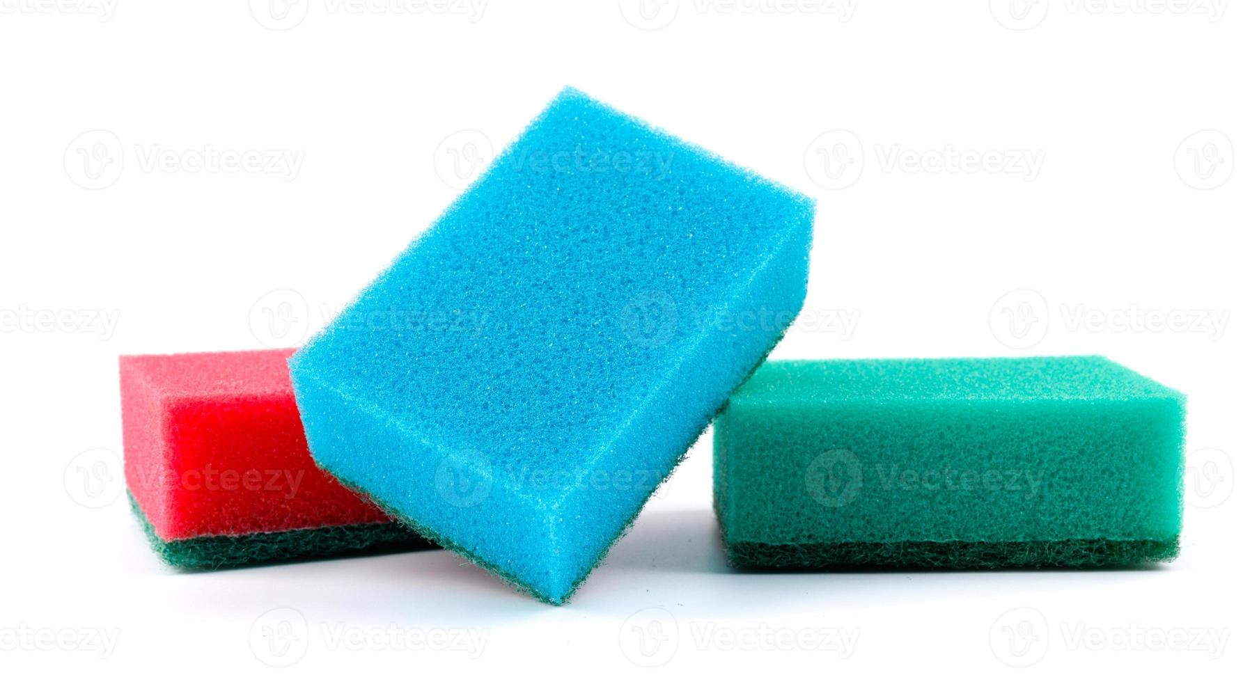 Several multi-colored sponges isolated on a white background. Sponge for washing dishes . photo