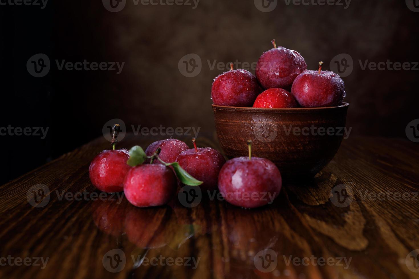 Clay plate with red apples. Red ripe apples. photo