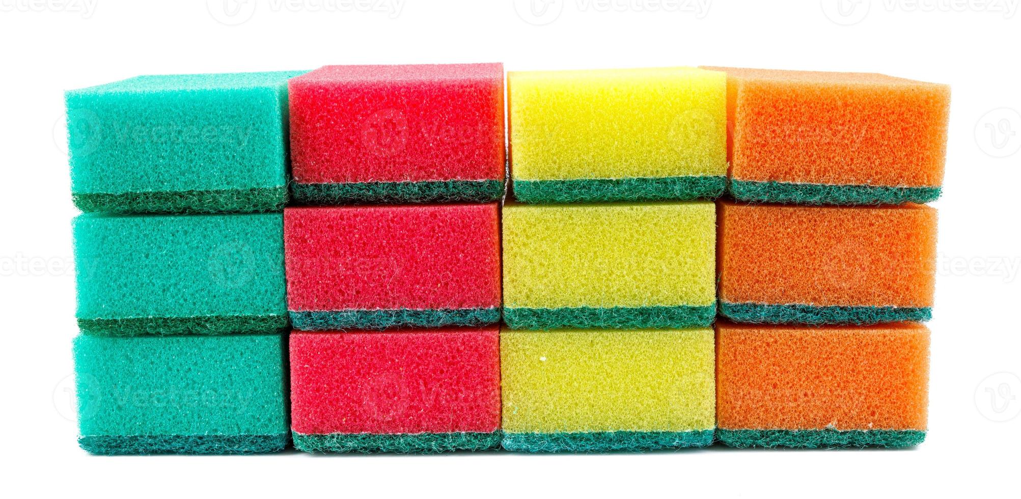 Several multi-colored sponges isolated on a white background. Sponge for washing dishes . photo