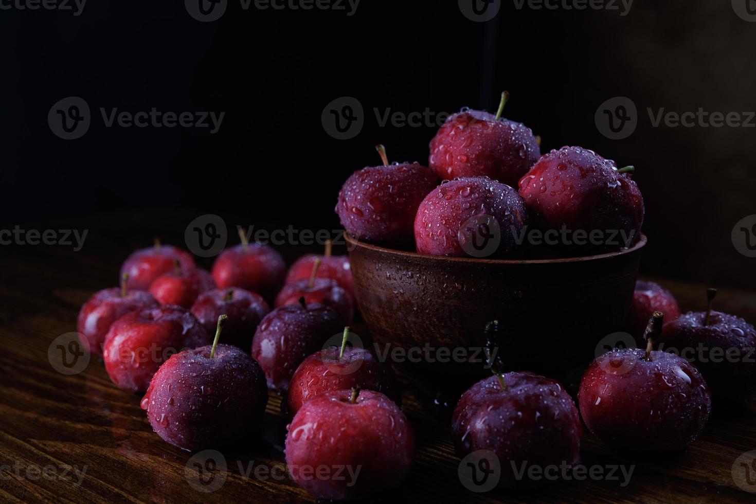 Clay plate with red apples. Red ripe apples. photo
