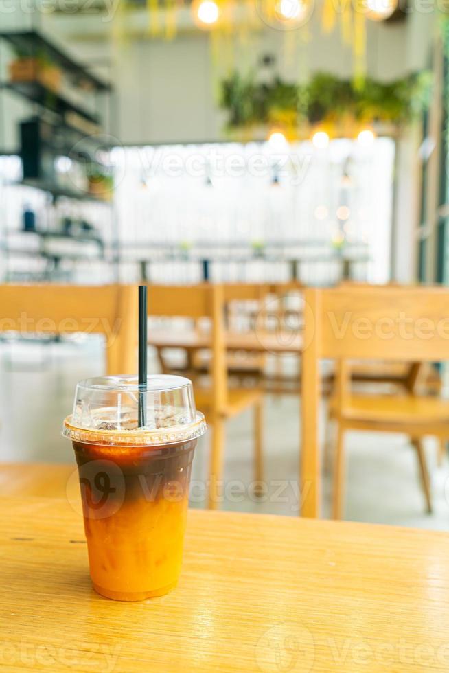 iced black coffee with yuzu cup on table photo