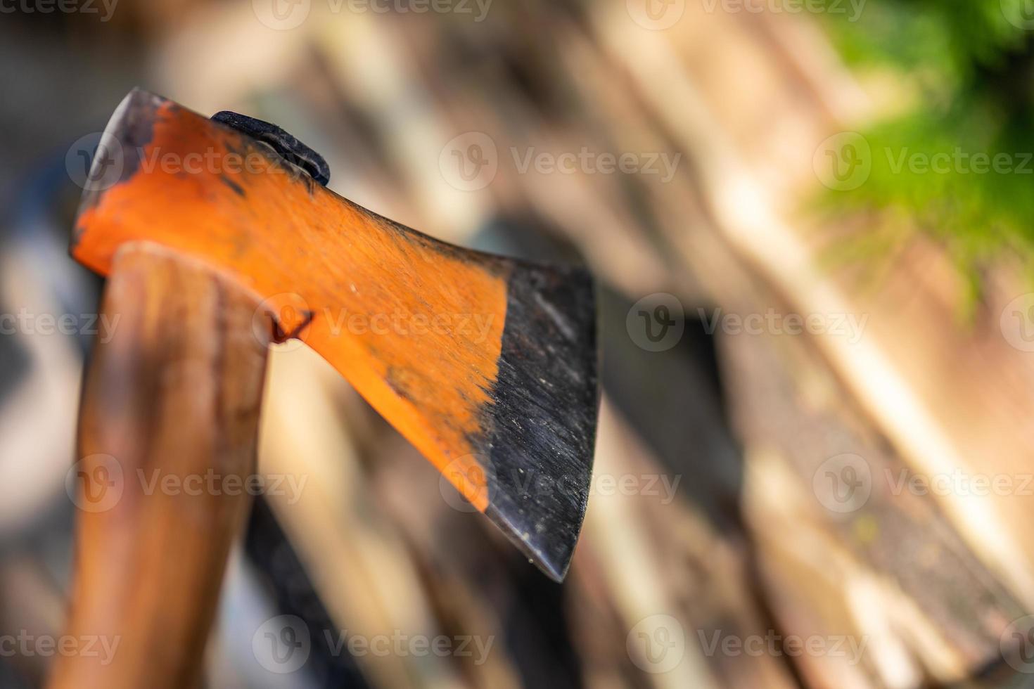 Axe in wood, chopping firewood, closeup photo