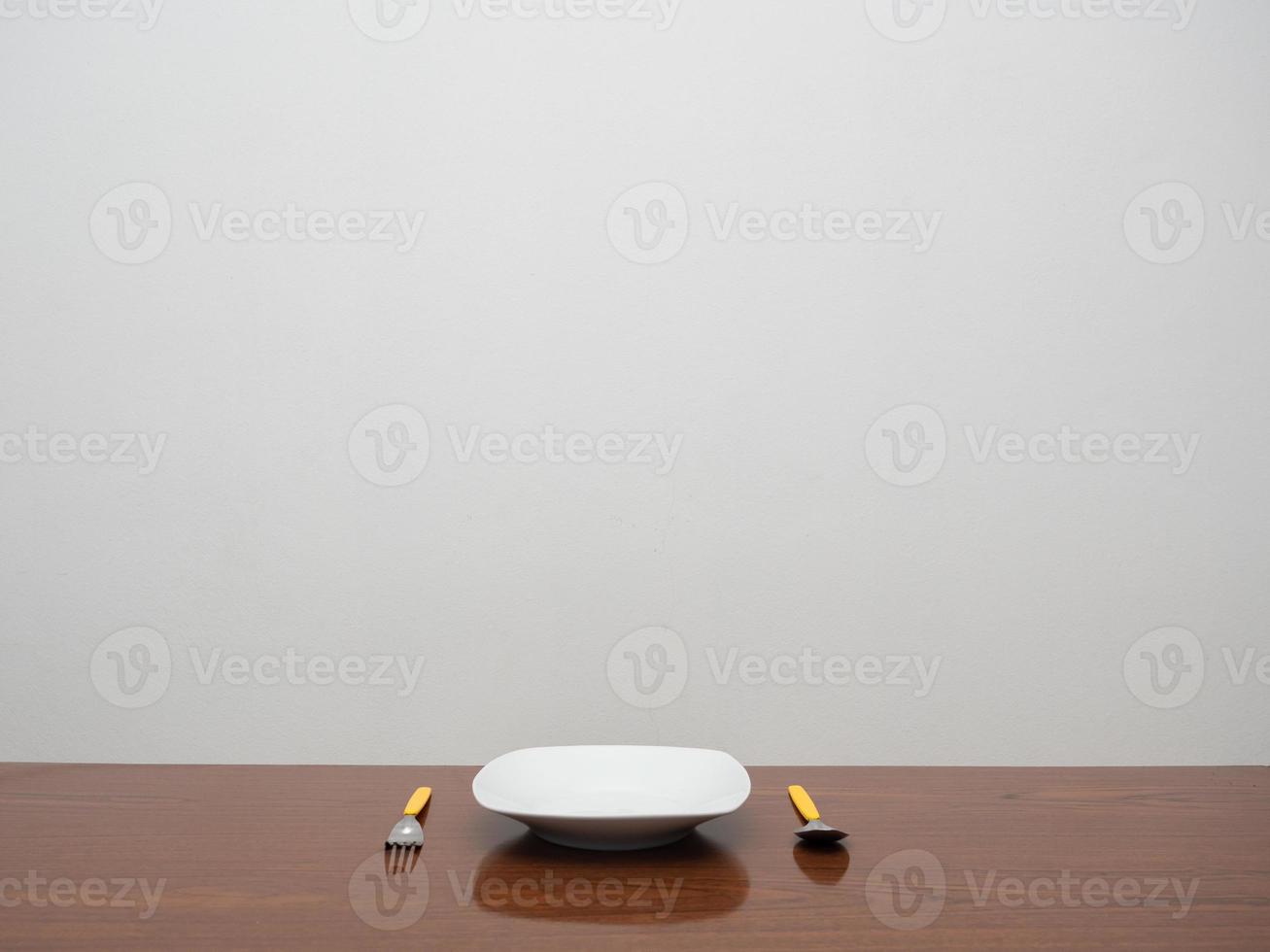 Dish with cutlery on the wood table copy space photo