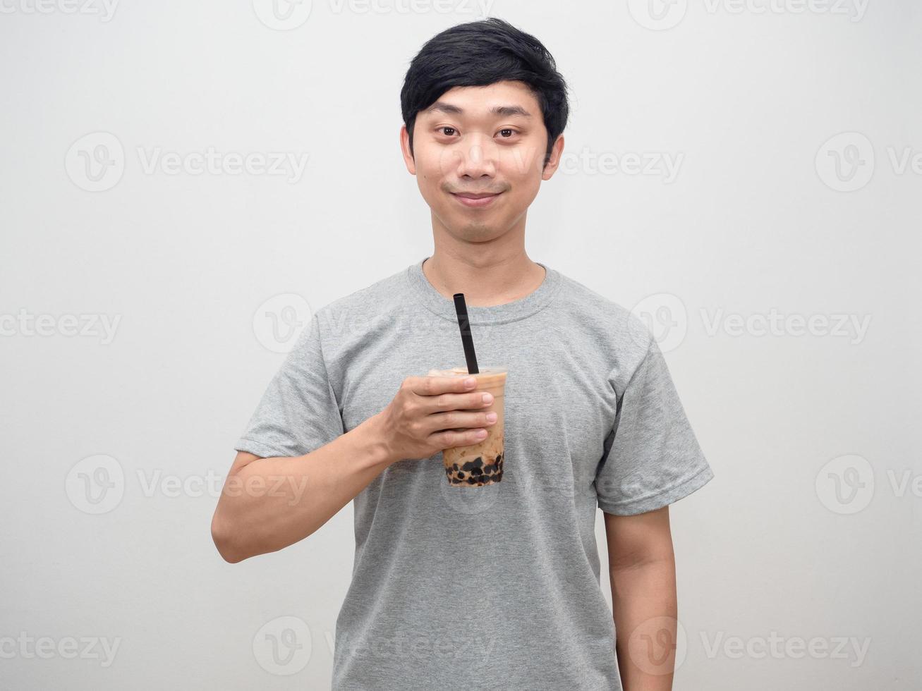 Positive man holding boba tea with happiness smile portrait photo