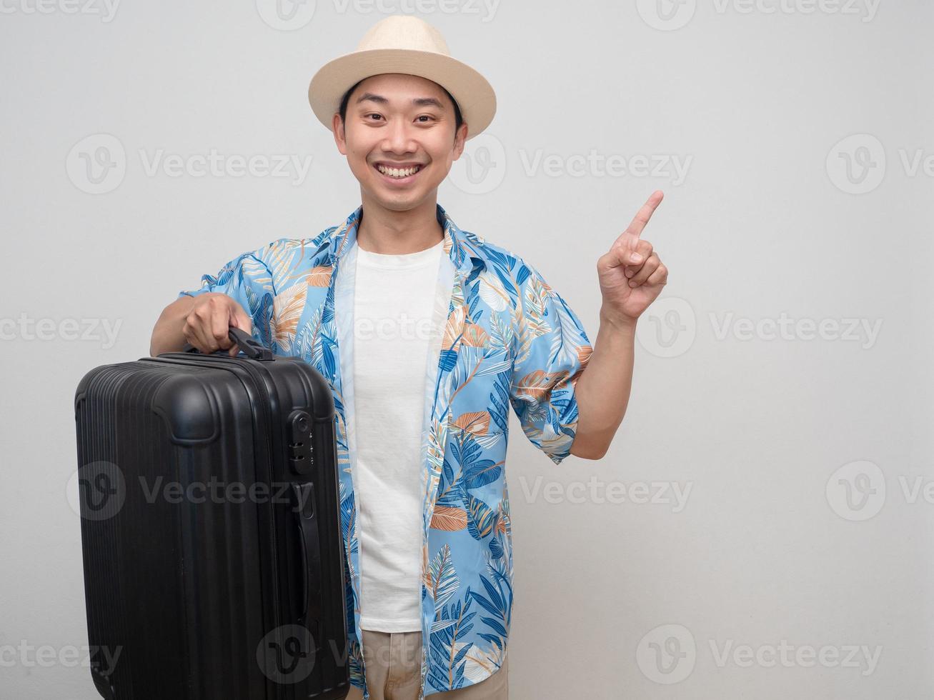 Cheerful man wear hat beach shirt smiling point finger isolated photo