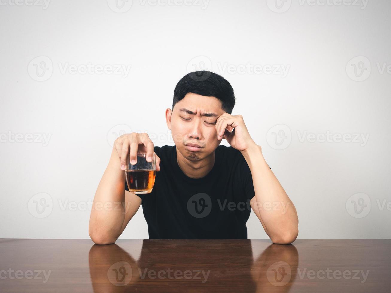 Lonely young man drunk with alcohol crying about feels sadness photo