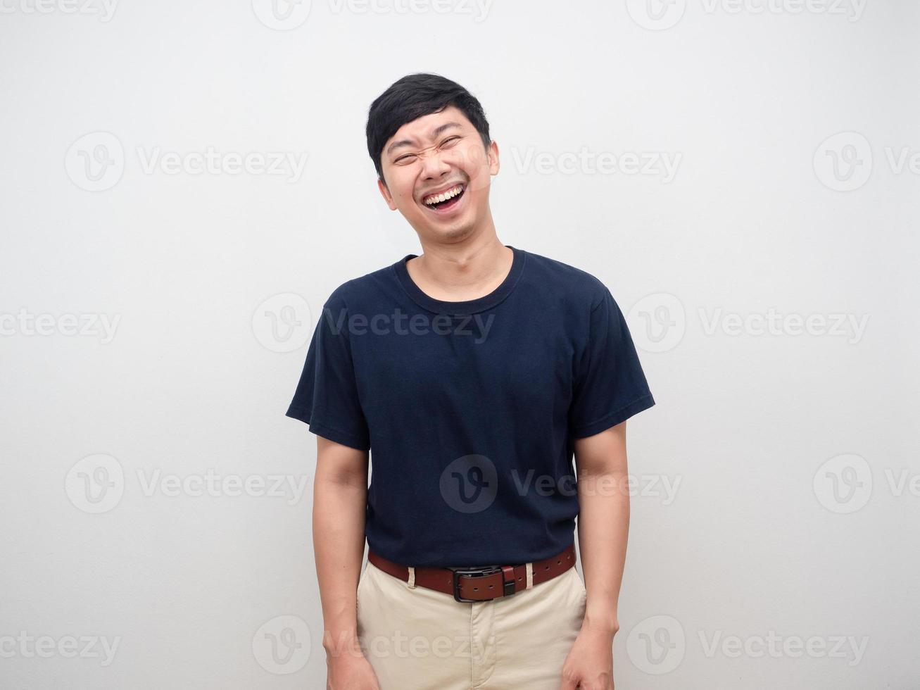 Portrait positive young man laugh standing on white background studio shot photo