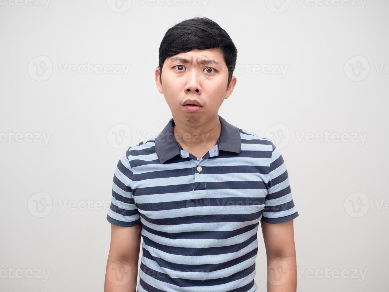 Portrait young man strip shirt confused emotion photo