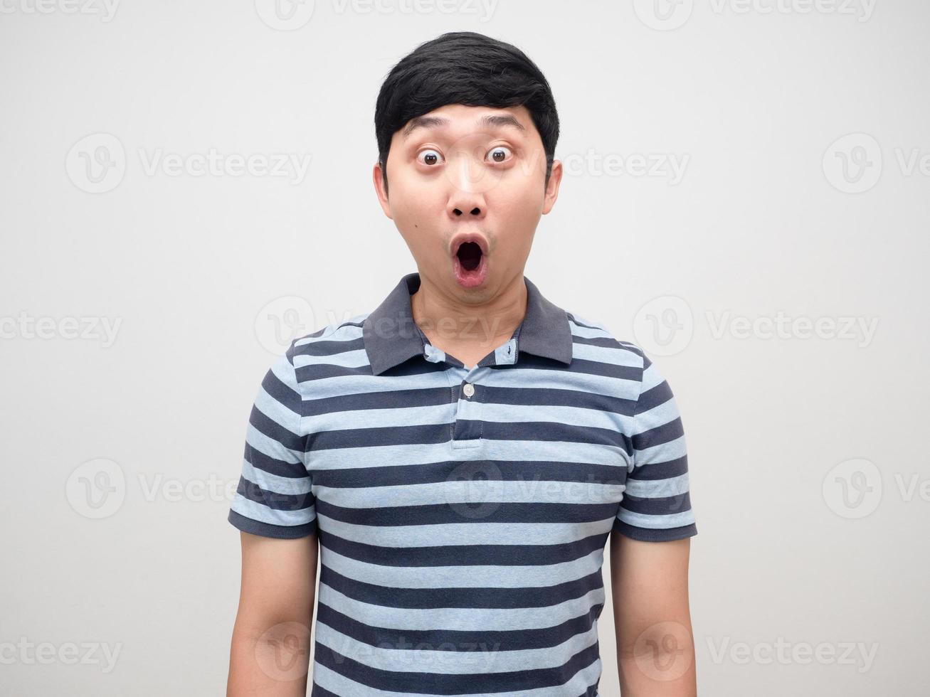 Young man striped shirt gesture shocked emotion isolated photo