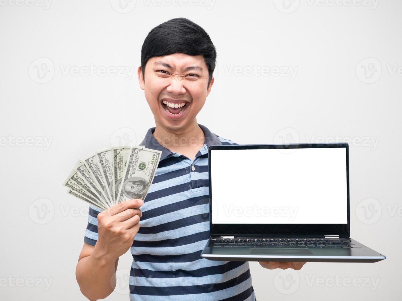 Young man satisfied with earn money about internet job holding laptop white screen photo