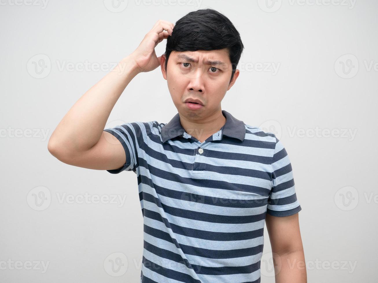 Asian man striped shirt scratch head confused emotion portrait photo