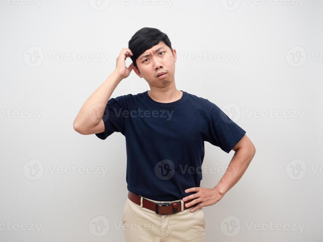 Man doubt and confused face scratch head standing studio shot isolated photo