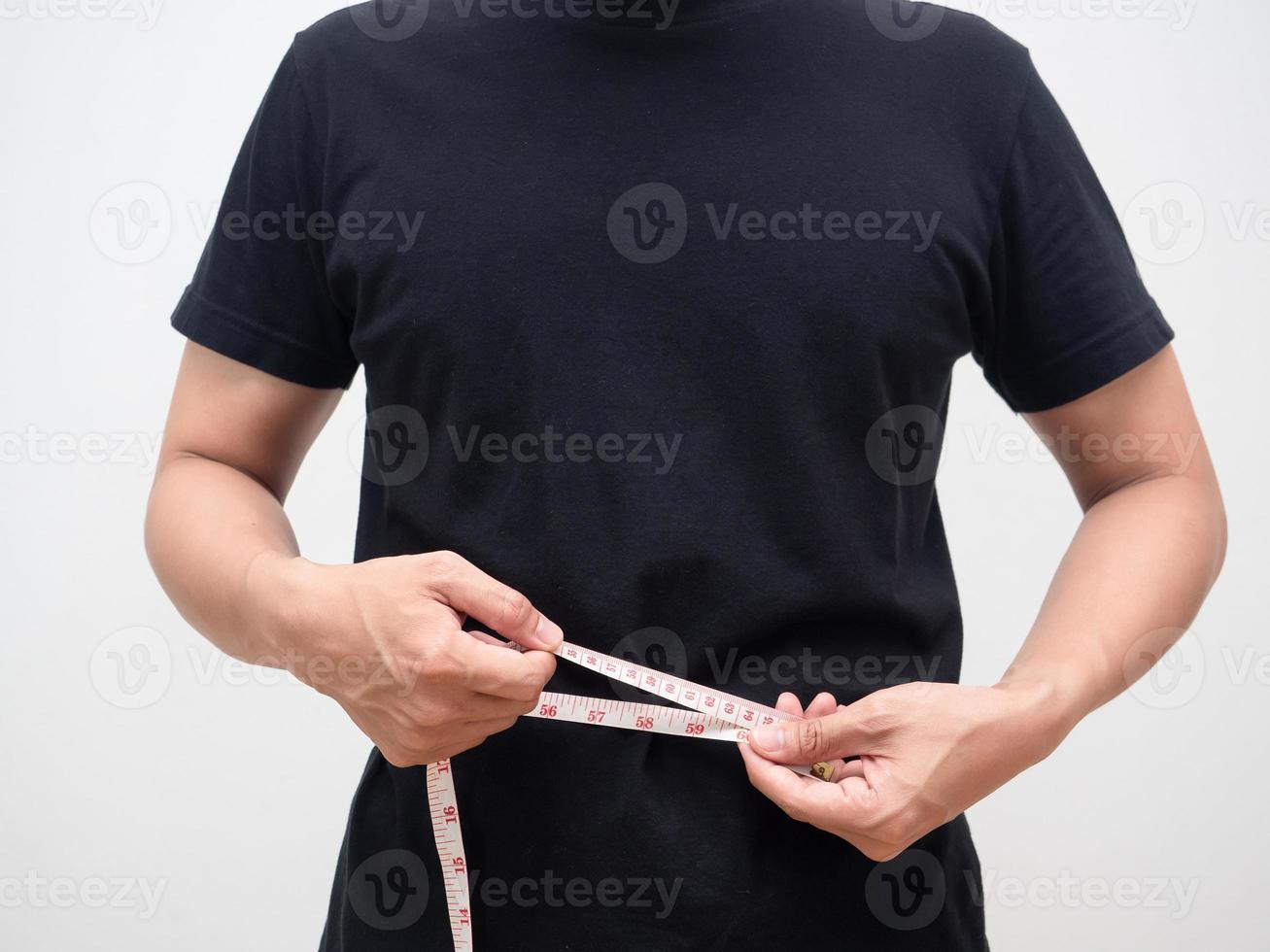 Man using measure tape body for checking his waist studio shot photo