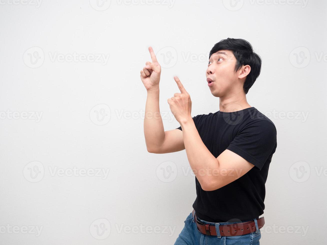 Young man gesture point finger feels excited copy space isolated photo