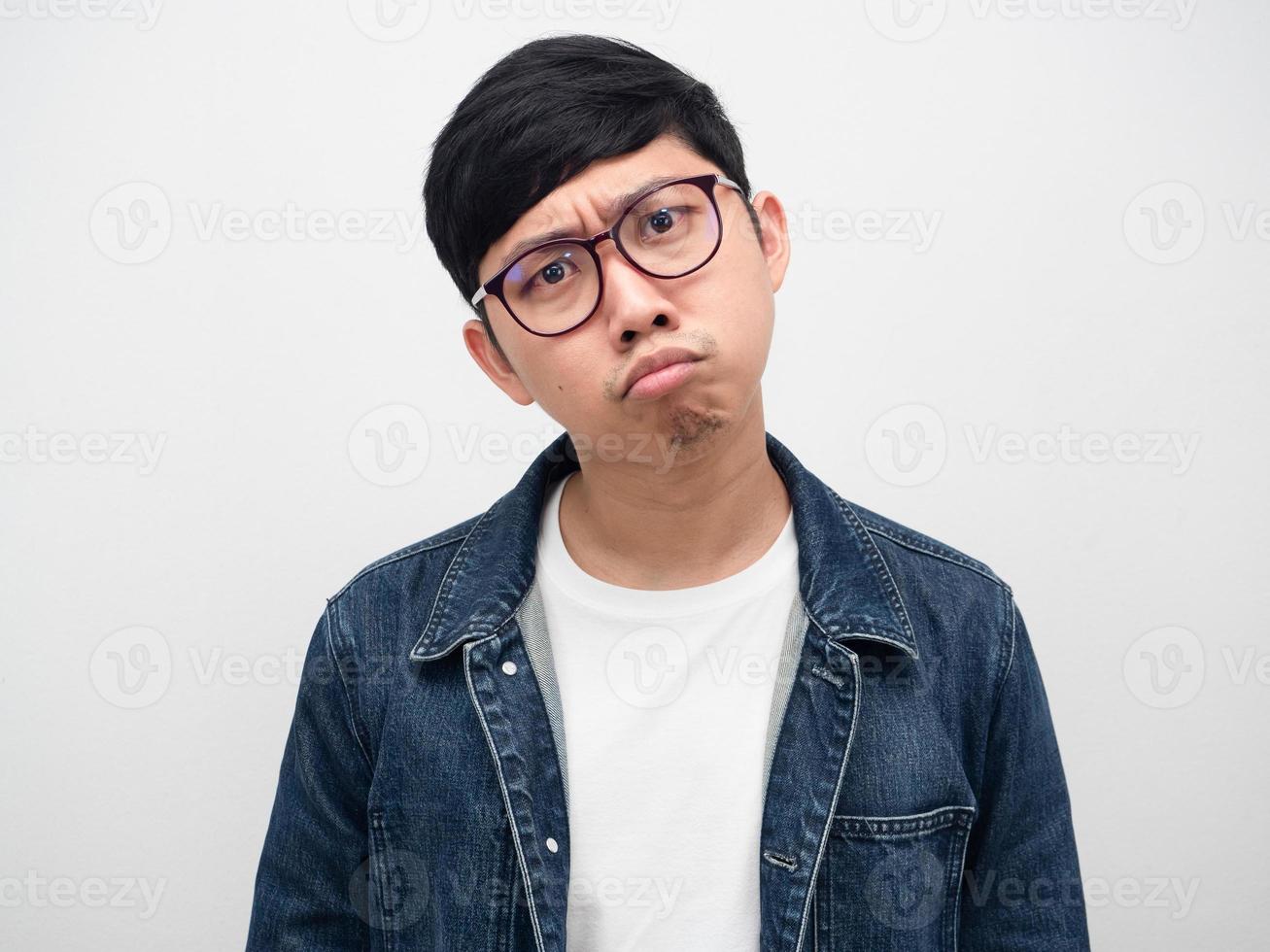 Man with glasses jeans shirt confused face portrait studio shot photo