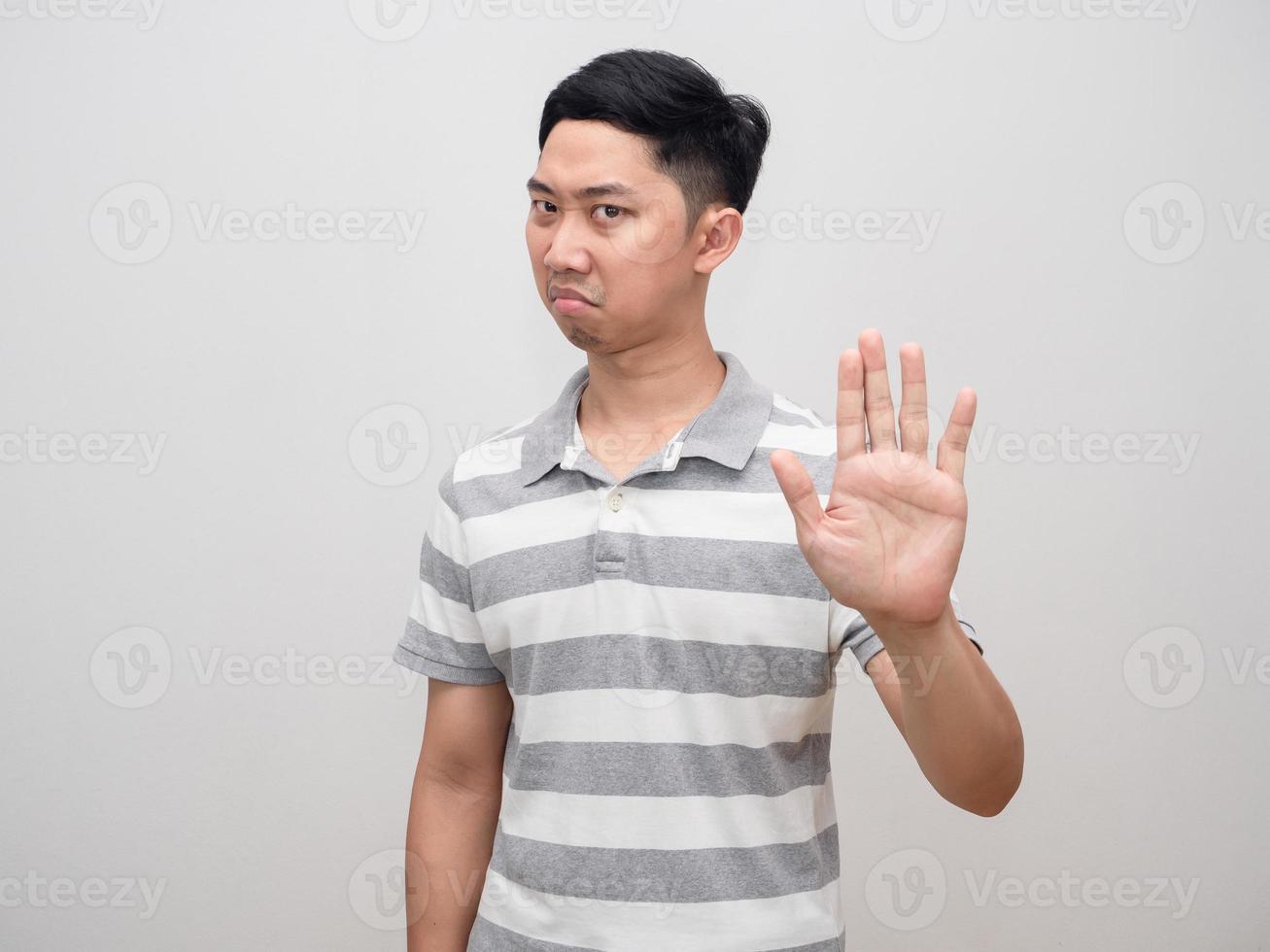 Asian man show hand stop say no,Man not agree isolated photo