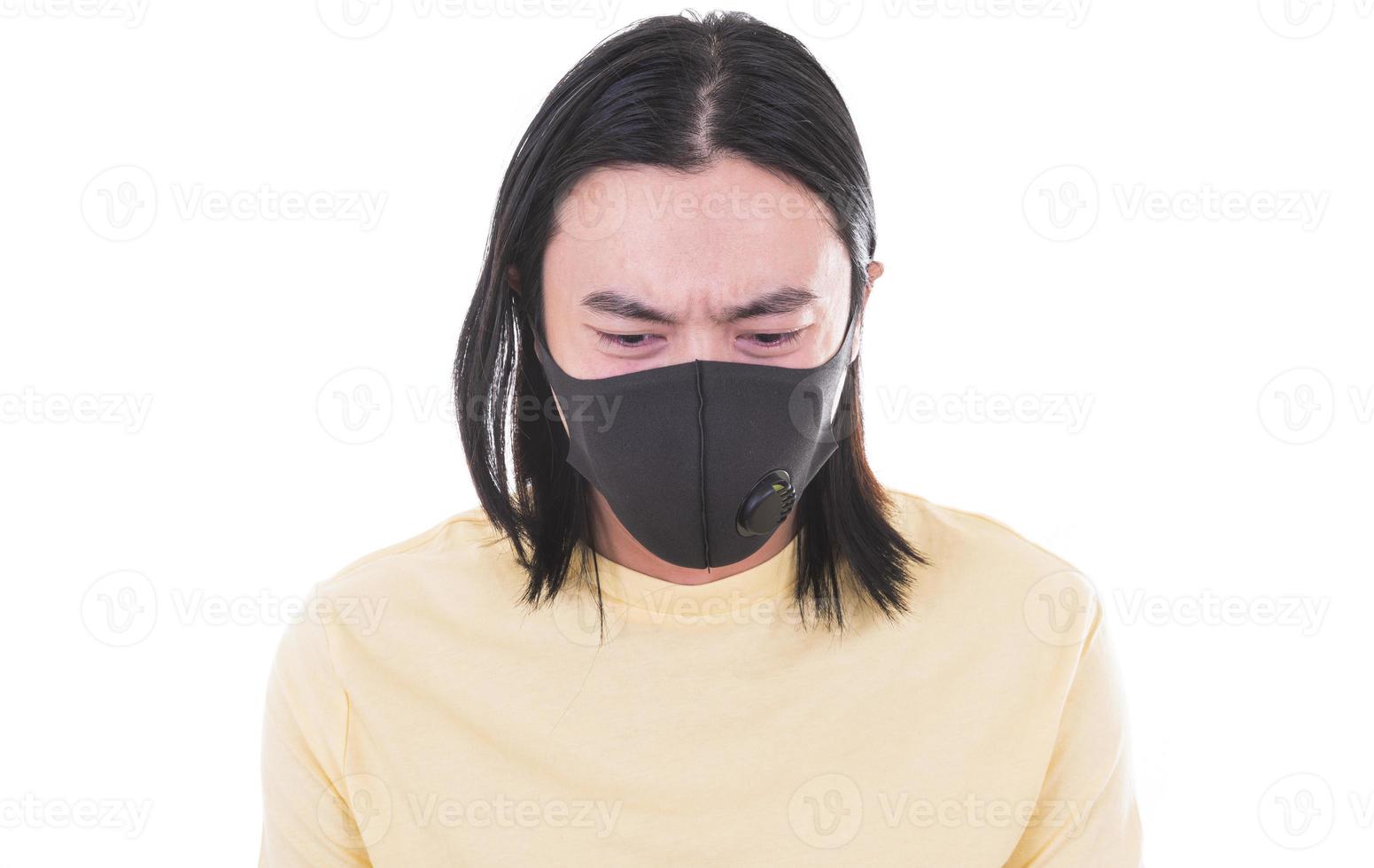 Asian man with breathing mask. Stop COVID Concept. young man wears a protective medical mask to prevent COVID-19 infection and showing the stop gesture photo
