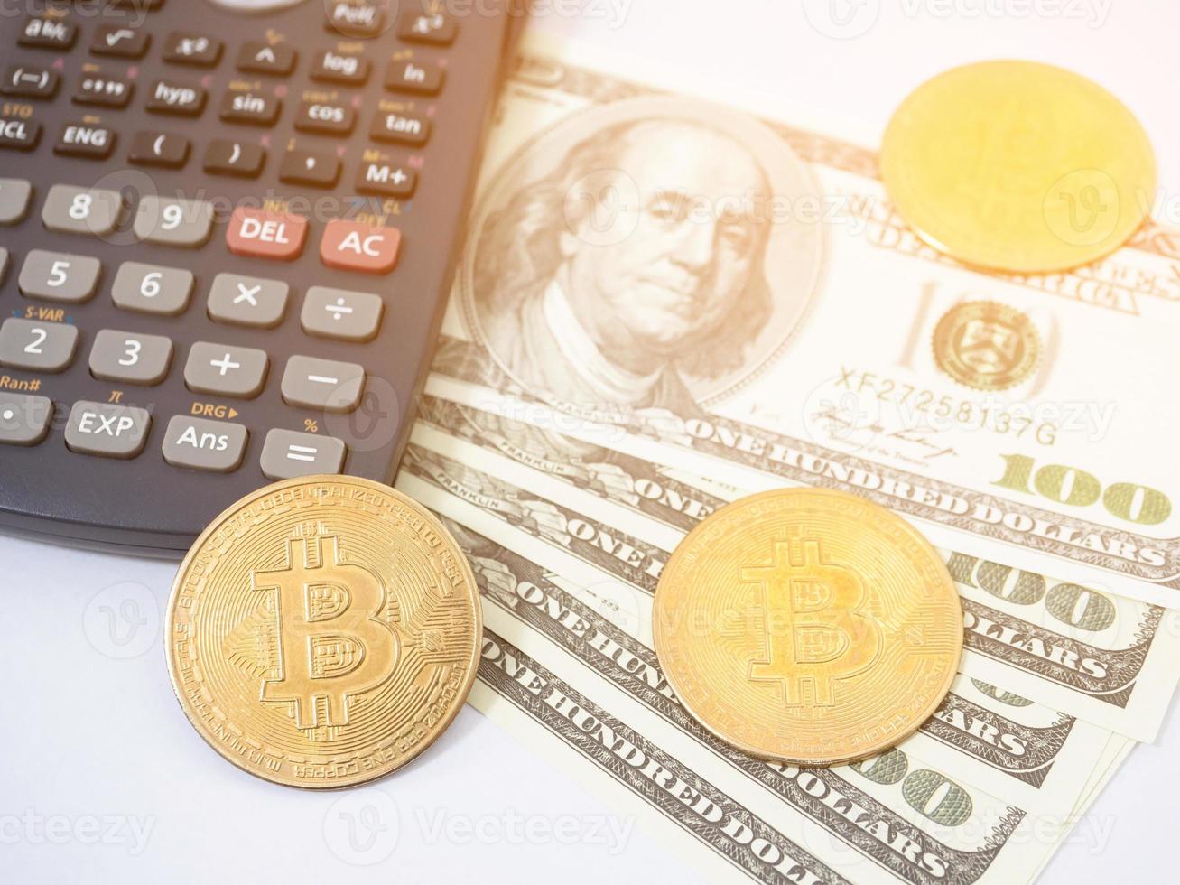 Closeup bitcoin with money the digital money concept light flare,Bitcoin money with calculator photo