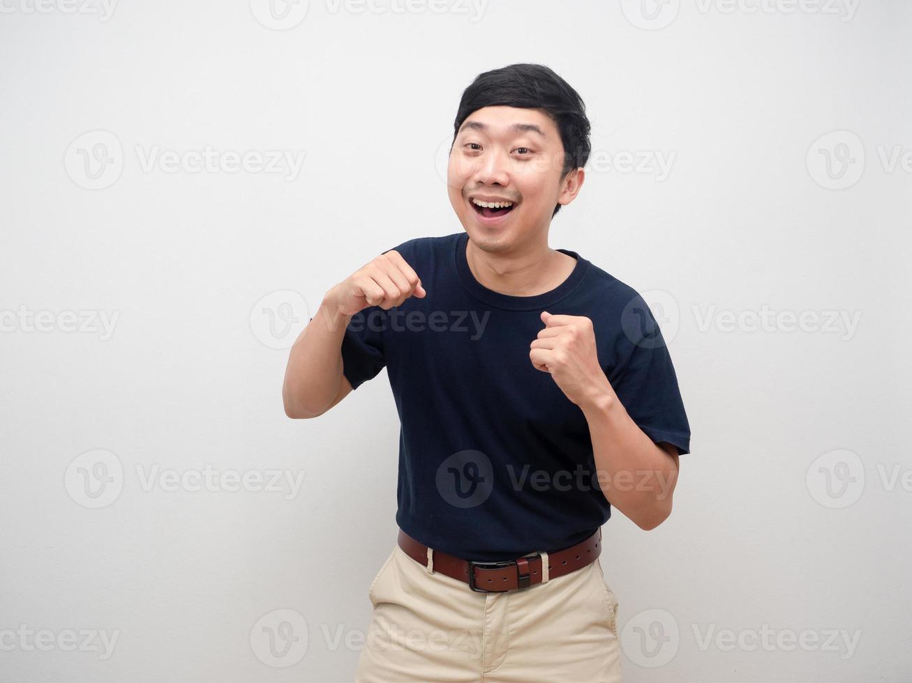 Young man cheerful and happiness emotion  dancing funny isolated photo