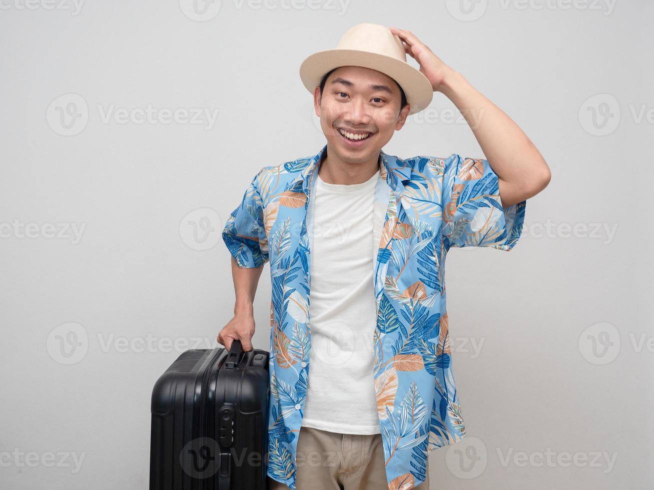 Tourism man wear hat hold luggage happiness smile portrait photo