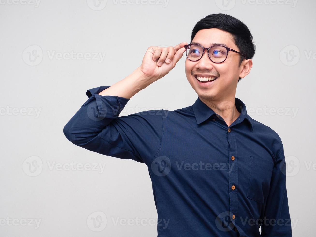 Cheerful businessman wear glasses turn around for looking copy space photo