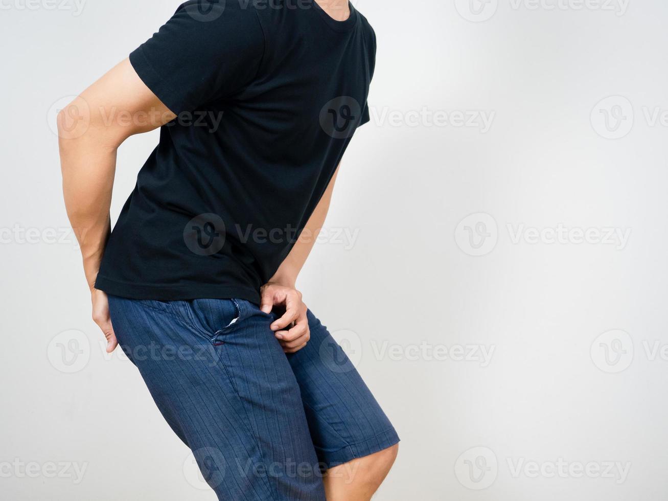 Man gesture pain pee with pain poop isolated studio shot photo