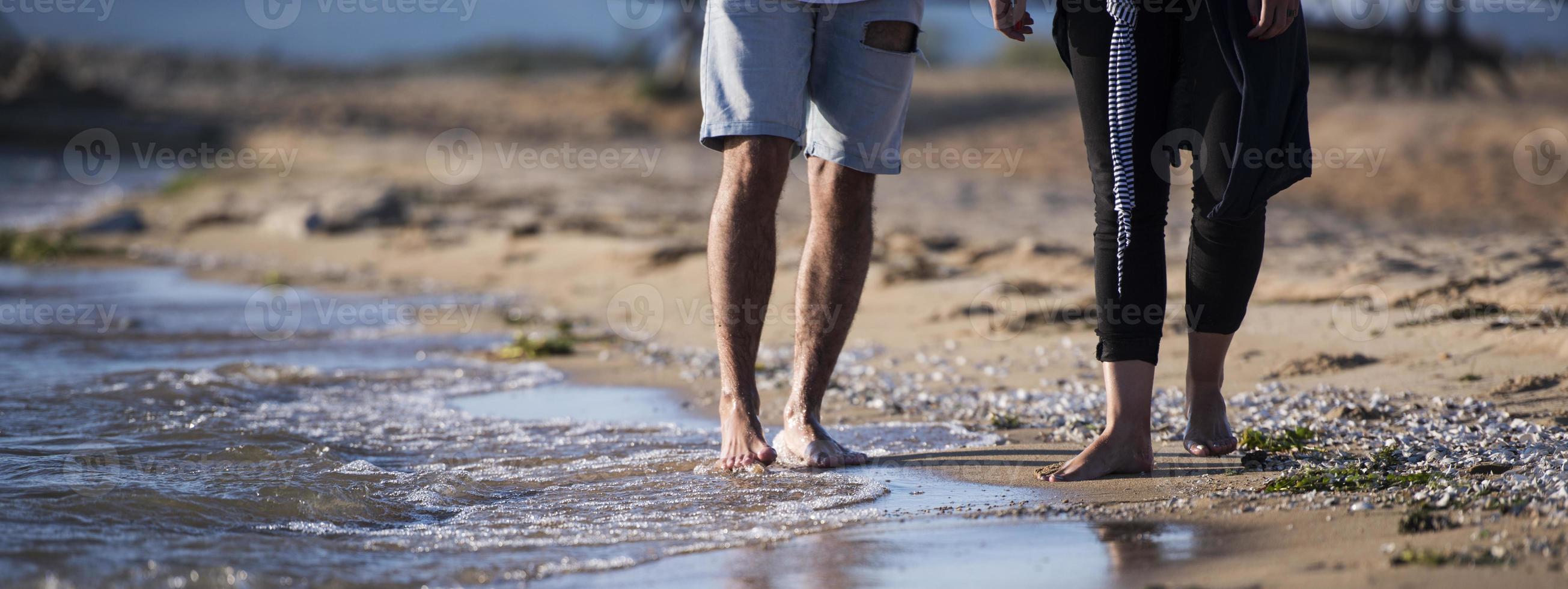 Happy Romantic Couple Enjoying Beautiful Sunset Walk on the Beach. Travel Vacation Retirement Lifestyle Concept photo