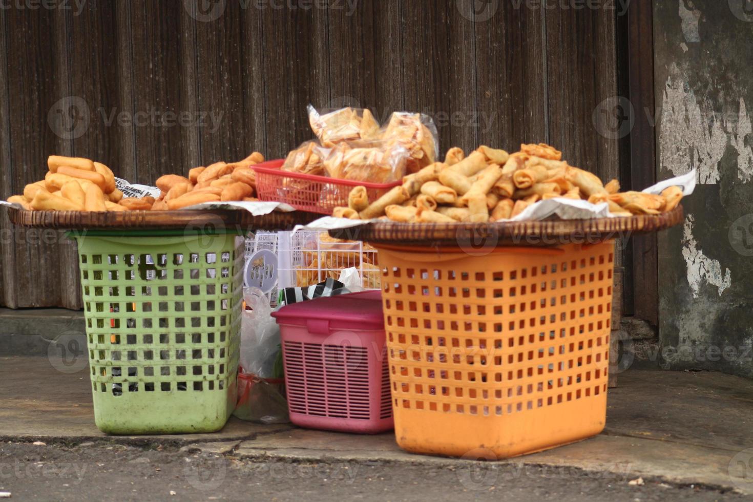 Fried snacks are sold at roadside stalls photo