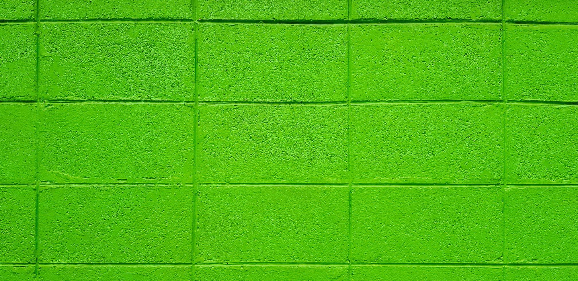 pared de ladrillo o bloque verde para el fondo. pastel y colorido pintado de papel tapiz de ladrillo. foto