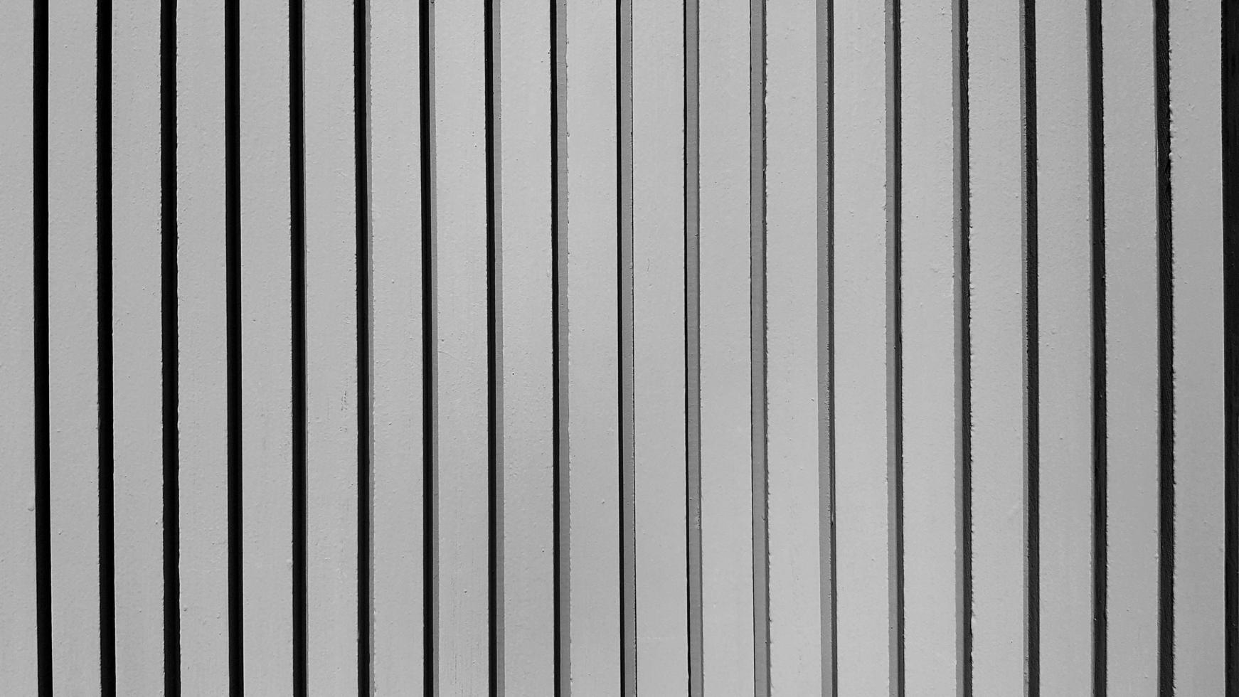 Gray pastel line pattern of concrete wall for background. Grey painted cement column of wallpaper and Exterior design or build structure. photo