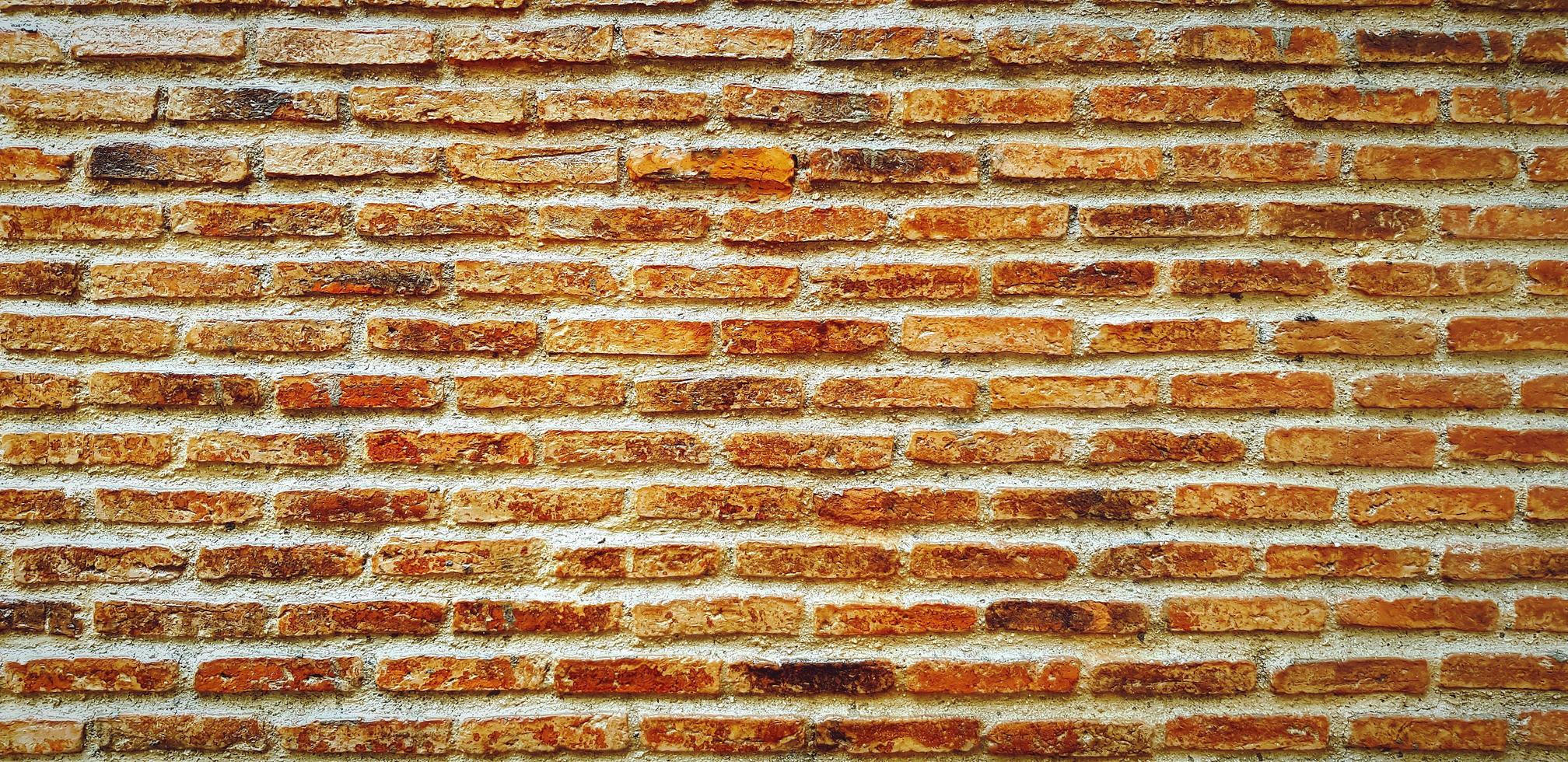 Brown or red brick wall for background. Line pattern and grunge, rough wallpaper. Building and Construction. Loft exterior design photo