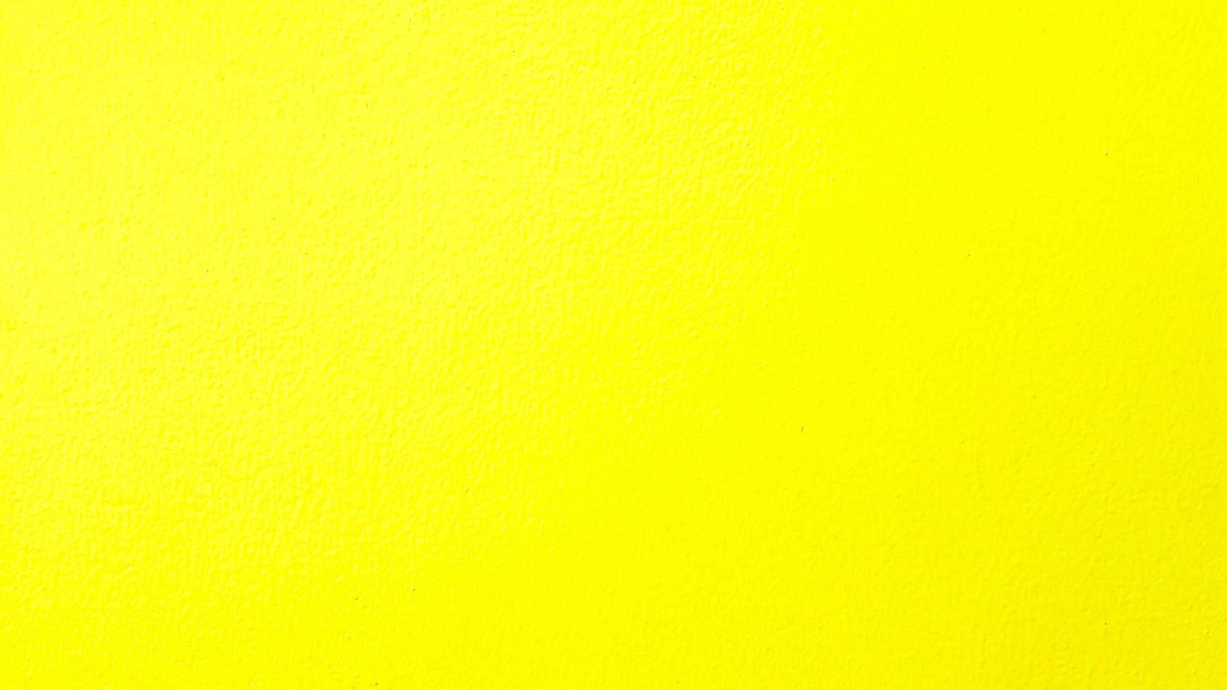 pared pintada de amarillo para el fondo. color colorido o pastel de papel tapiz de hormigón. foto