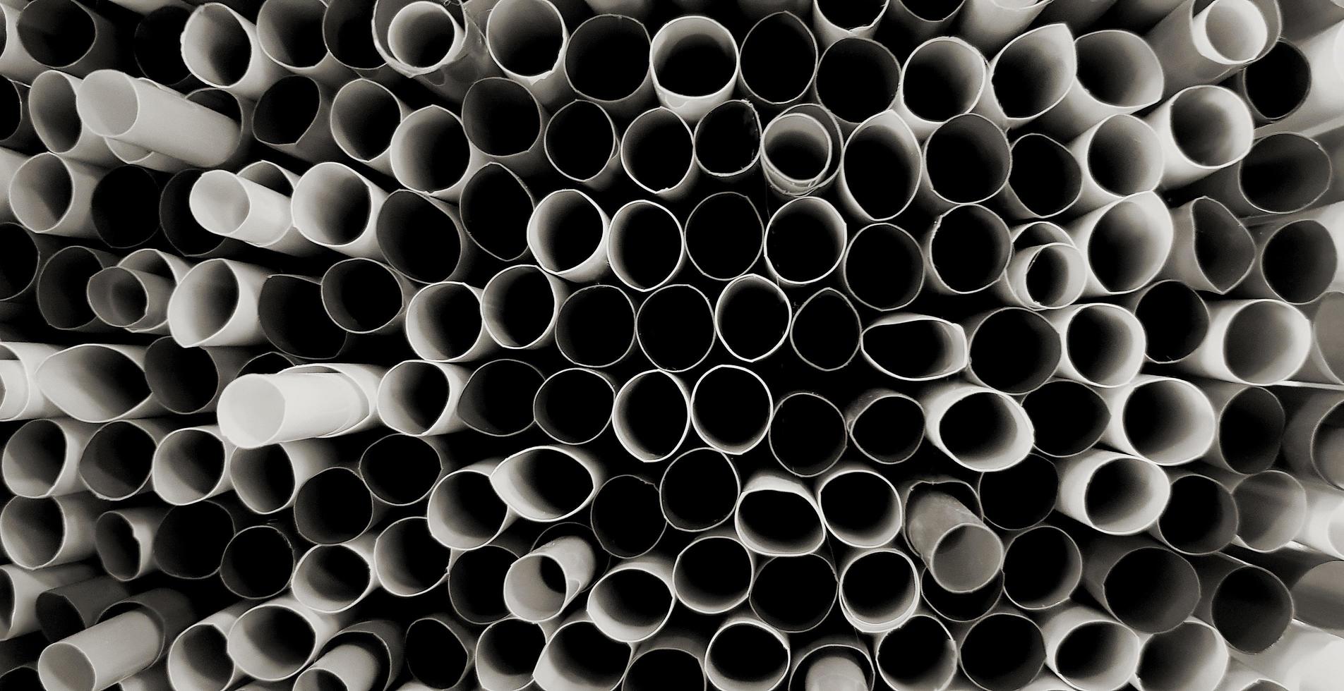 Pattern art of Dark water tube for background black and white tone or monochrome. Abstract of object wallpaper or wall concept with selective focus. photo