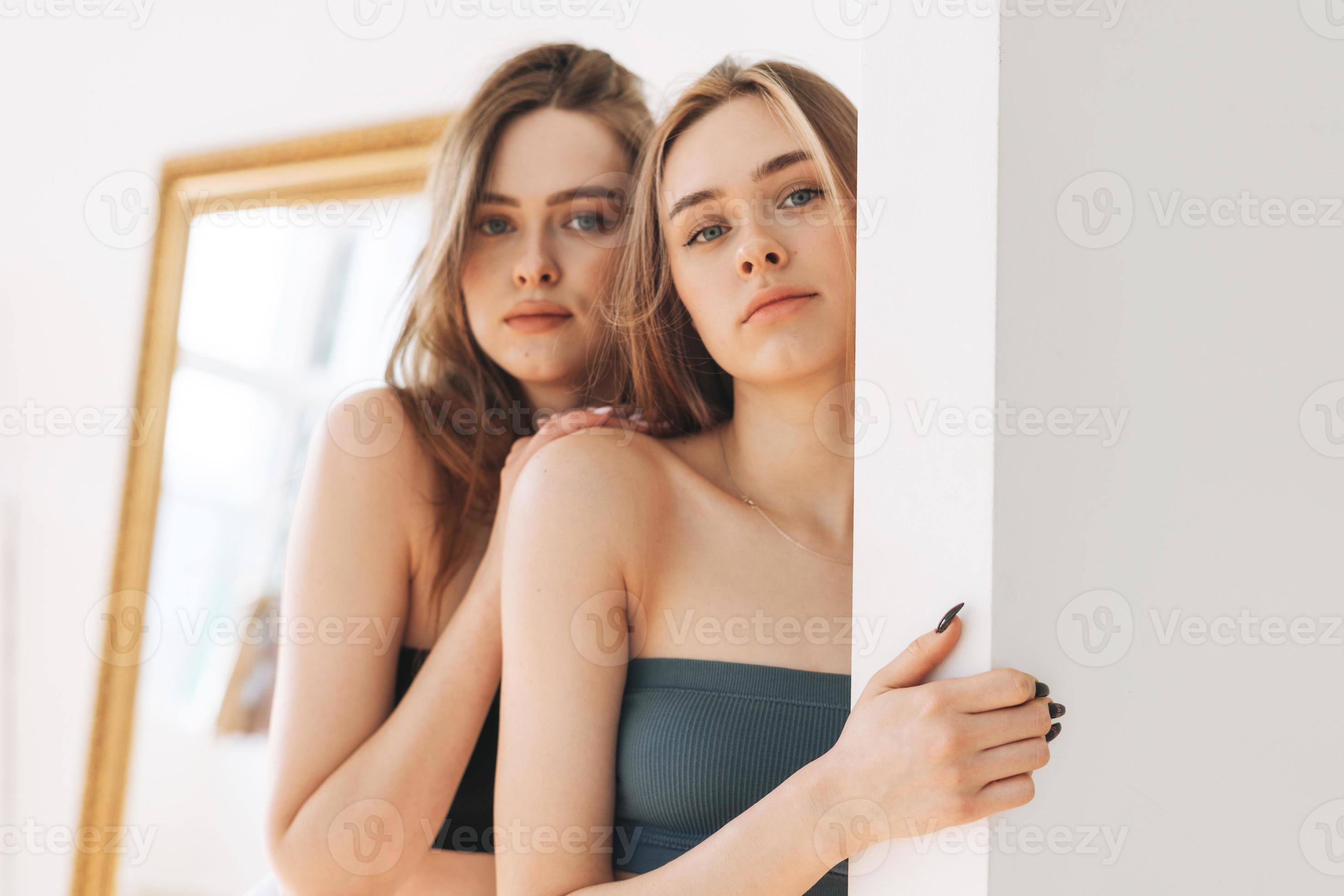 Fashion beauty models two sisters twins beautiful girls with long hair in  sport seamless ribbed underwear in the bright studio 16799305 Stock Photo  at Vecteezy